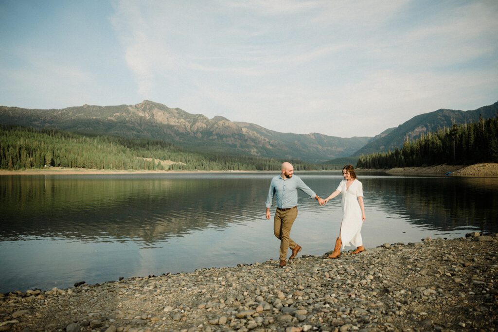 Hyalite Canyon Engagement Session with epic mountain views, lake magic, dog-friendly trails, and a hilarious Halloween ghost twist. Fun, real,  SO Bozeman. 