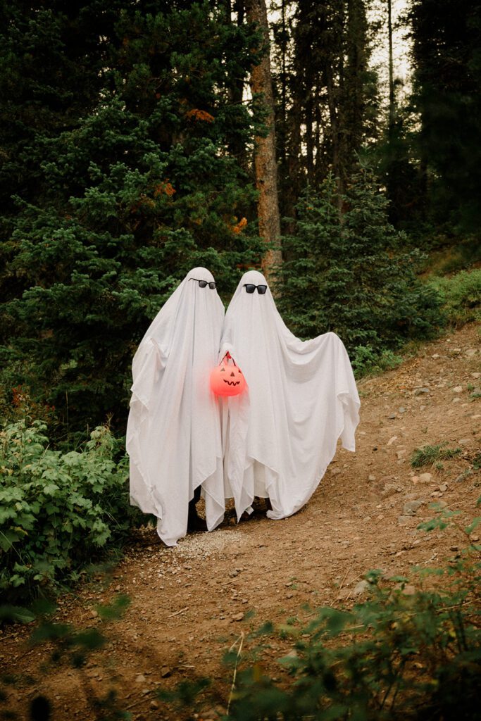 Hyalite Canyon Engagement Session with epic mountain views, lake magic, dog-friendly trails, and a hilarious Halloween ghost twist. Fun, real,  SO Bozeman. 