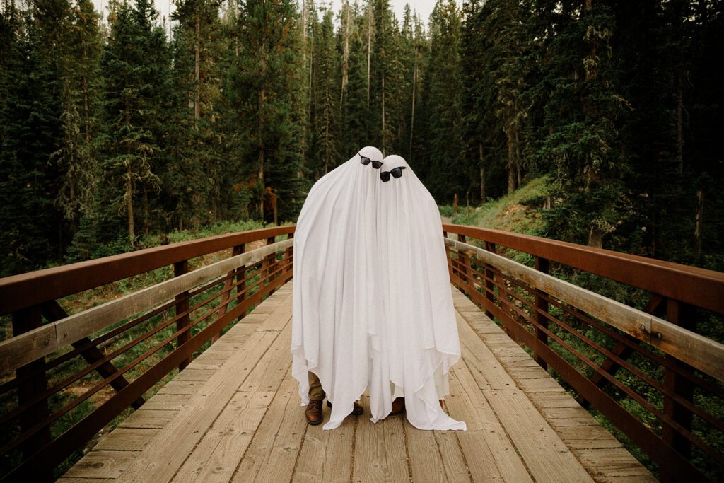 Hyalite Canyon Engagement Session with epic mountain views, lake magic, dog-friendly trails, and a hilarious Halloween ghost twist. Fun, real,  SO Bozeman. 