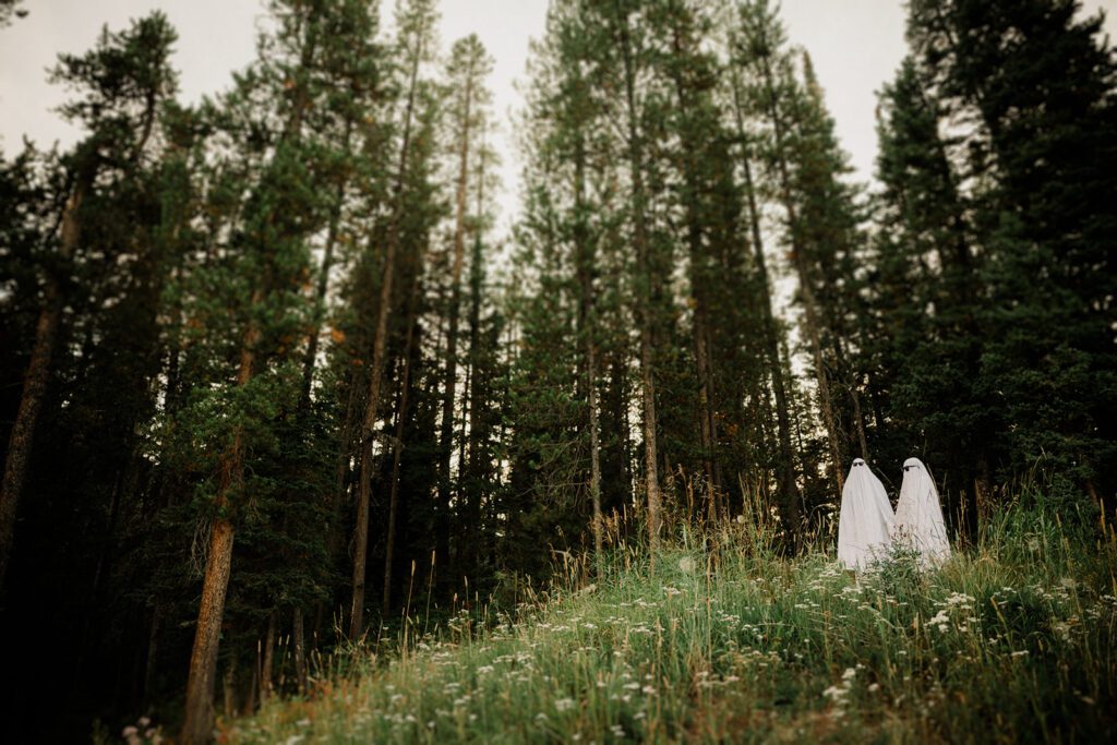 Hyalite Canyon Engagement Session with epic mountain views, lake magic, dog-friendly trails, and a hilarious Halloween ghost twist. Fun, real,  SO Bozeman. 