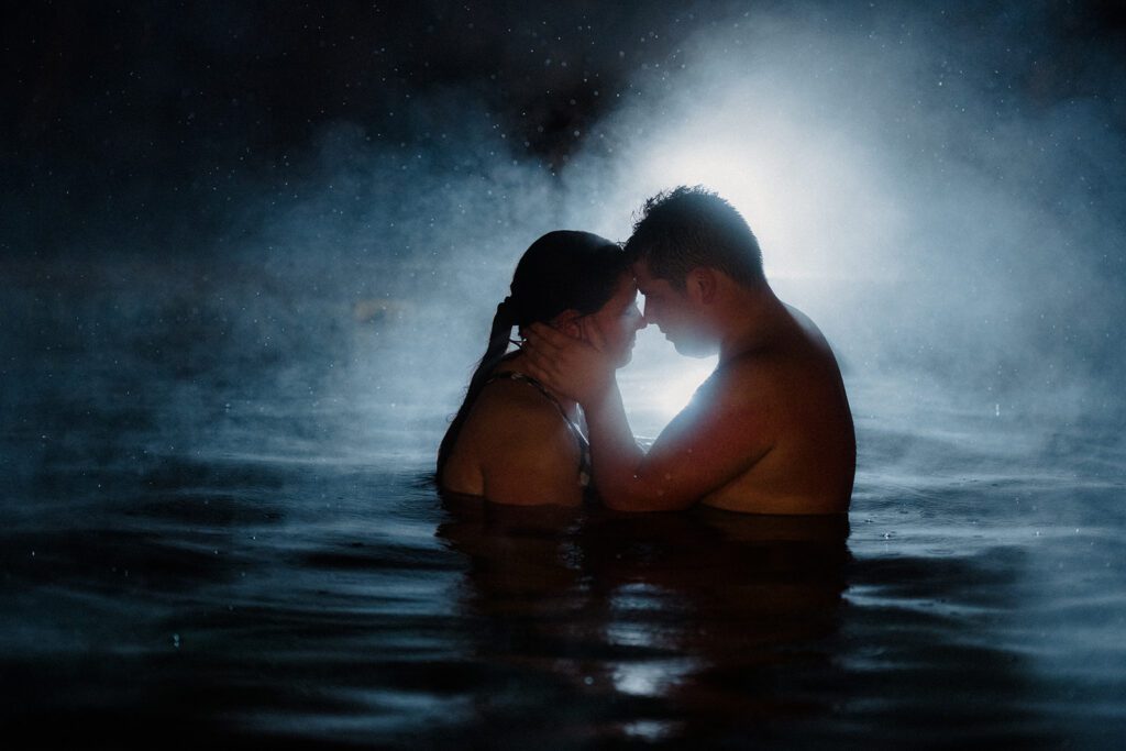 Couple in a hot springs enjoying their honeymoon.