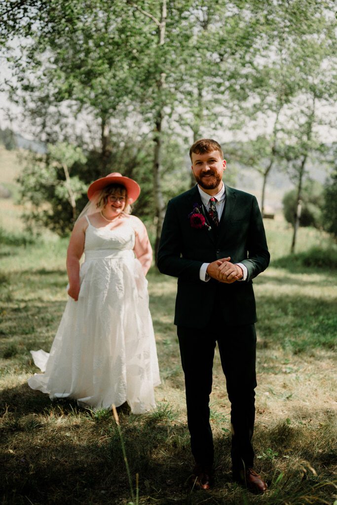 A fun non-traditional wedding in Bozeman with flower baskets, pizza, a “gaggle” wedding party, and sunset photos. See how this couple rewrote the rules.