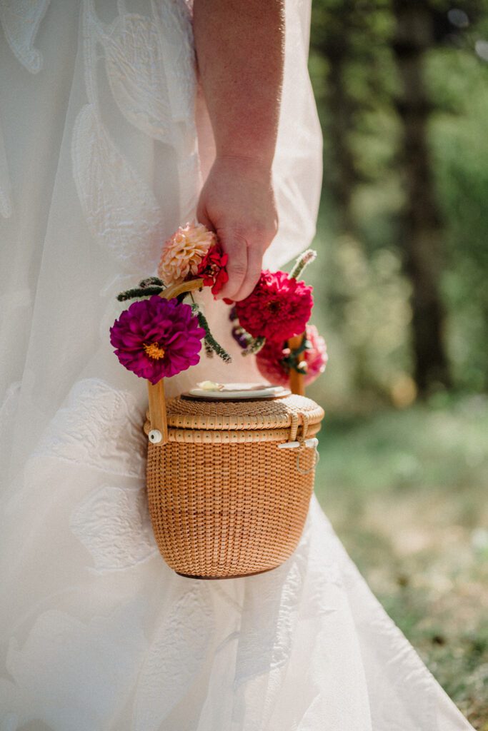 A fun non-traditional wedding in Bozeman with flower baskets, pizza, a “gaggle” wedding party, and sunset photos. See how this couple rewrote the rules.