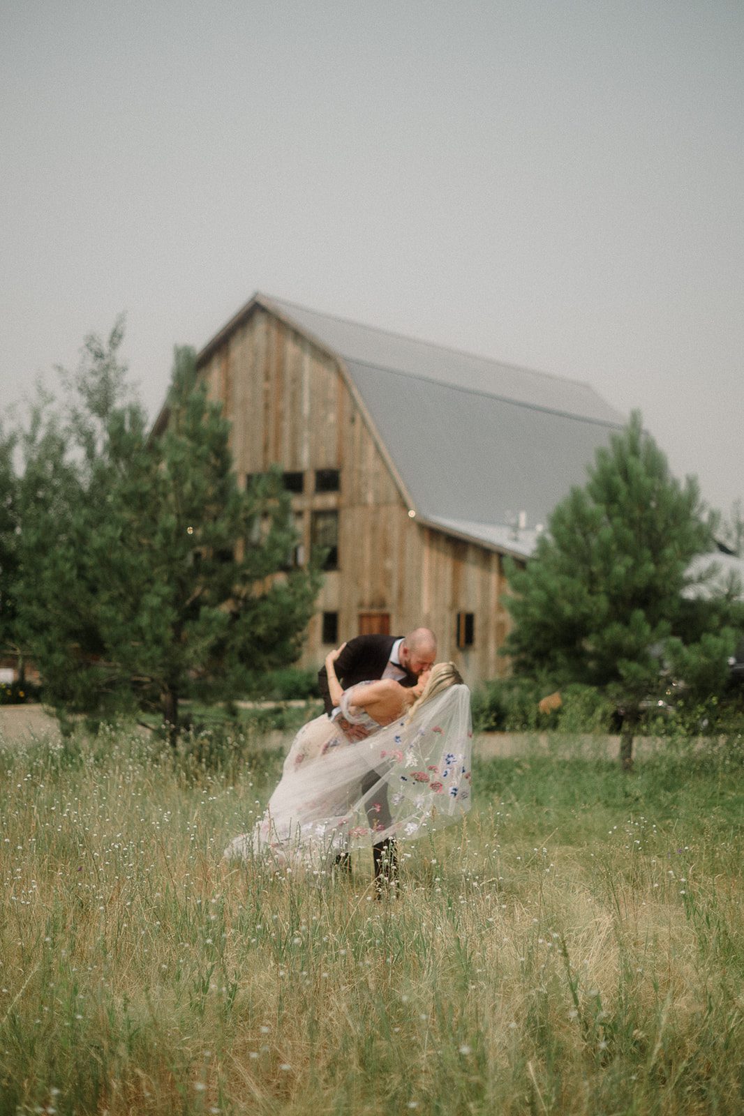 Colorful modern wedding in Bozeman at Firelight Farm featuring vibrant fashion, Filipino desserts, sunset portraits, and a disco after party.