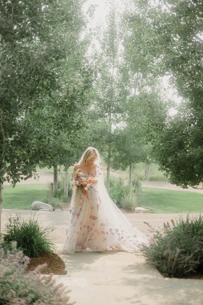 Colorful modern wedding in Bozeman at Firelight Farm featuring vibrant fashion, Filipino desserts, sunset portraits, and a disco after party.