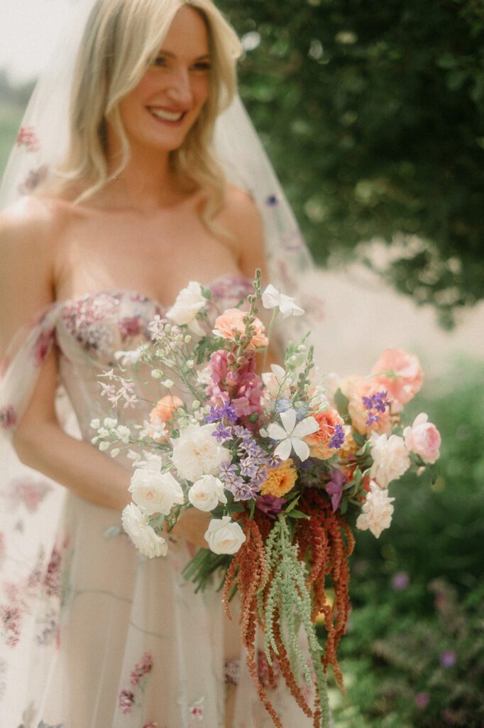 Colorful modern wedding in Bozeman at Firelight Farm featuring vibrant fashion, Filipino desserts, sunset portraits, and a disco after party.