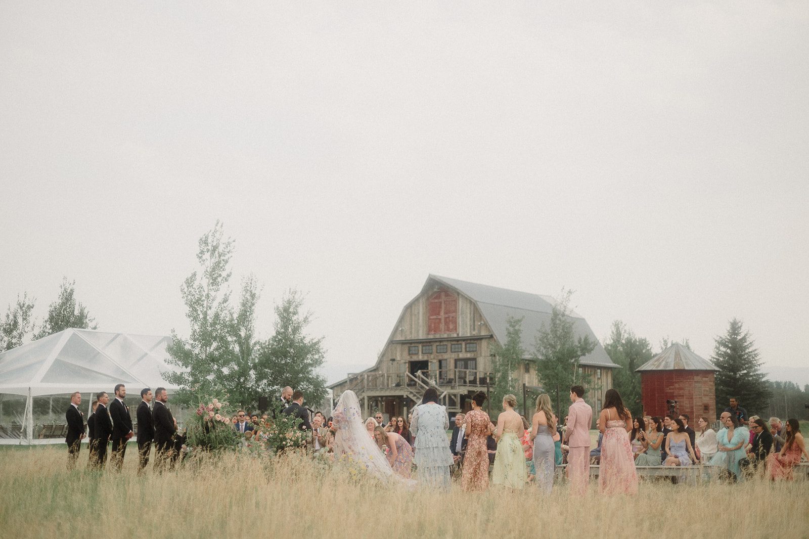 Colorful modern wedding in Bozeman at Firelight Farm featuring vibrant fashion, Filipino desserts, sunset portraits, and a disco after party.