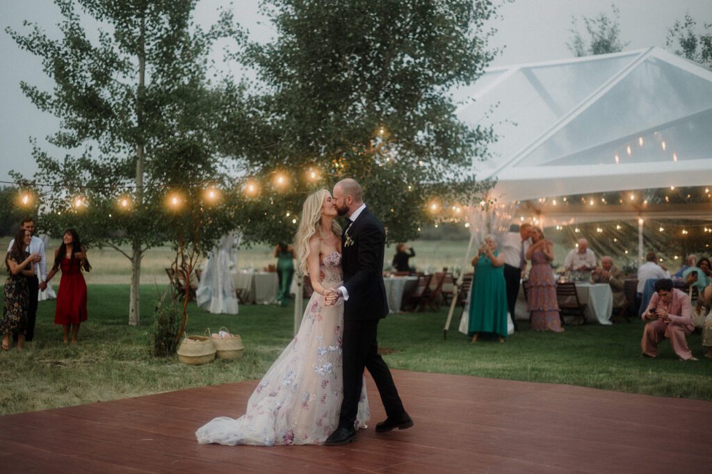 Colorful modern wedding in Bozeman at Firelight Farm featuring vibrant fashion, Filipino desserts, sunset portraits, and a disco after party.