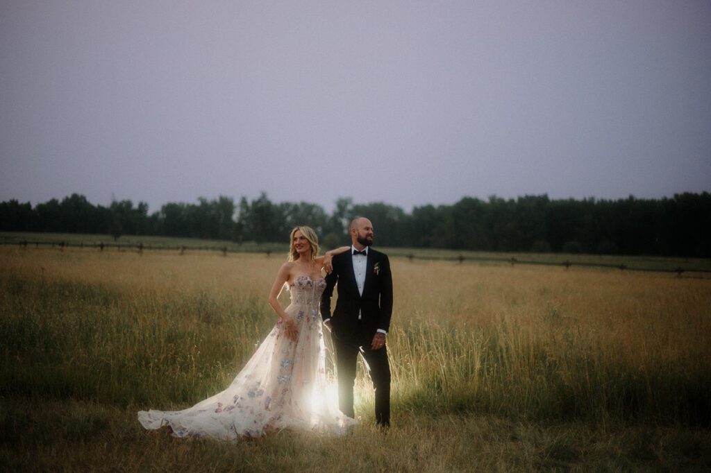 Colorful modern wedding in Bozeman at Firelight Farm featuring vibrant fashion, Filipino desserts, sunset portraits, and a disco after party.