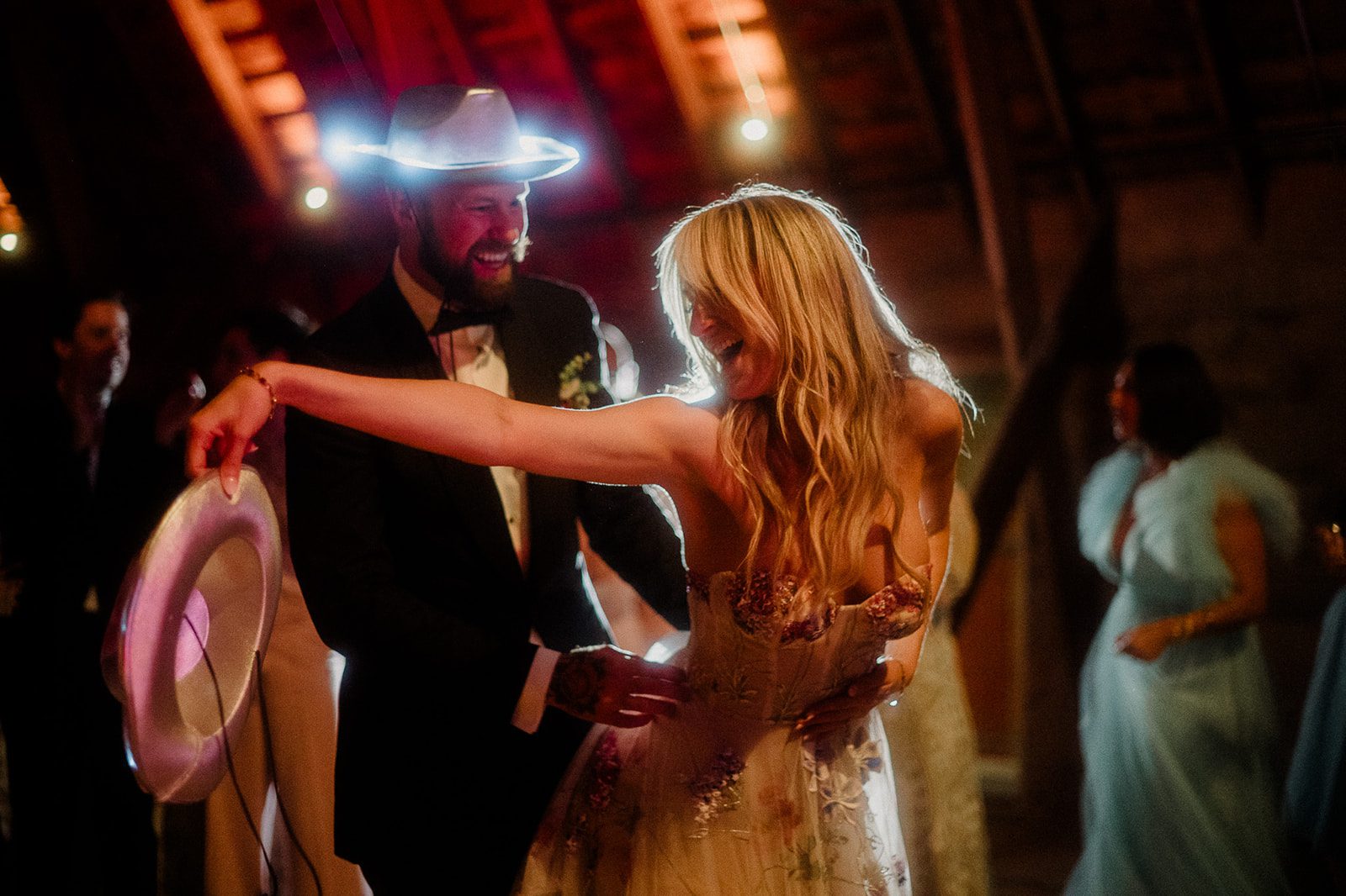 Colorful modern wedding in Bozeman at Firelight Farm featuring vibrant fashion, Filipino desserts, sunset portraits, and a disco after party.