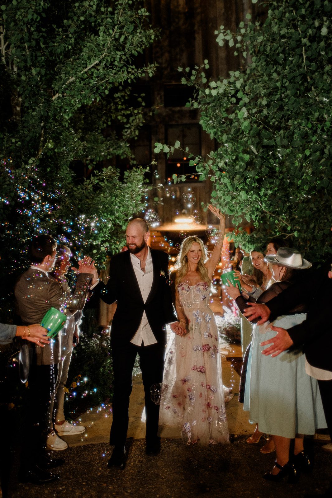 Colorful modern wedding in Bozeman at Firelight Farm featuring vibrant fashion, Filipino desserts, sunset portraits, and a disco after party.