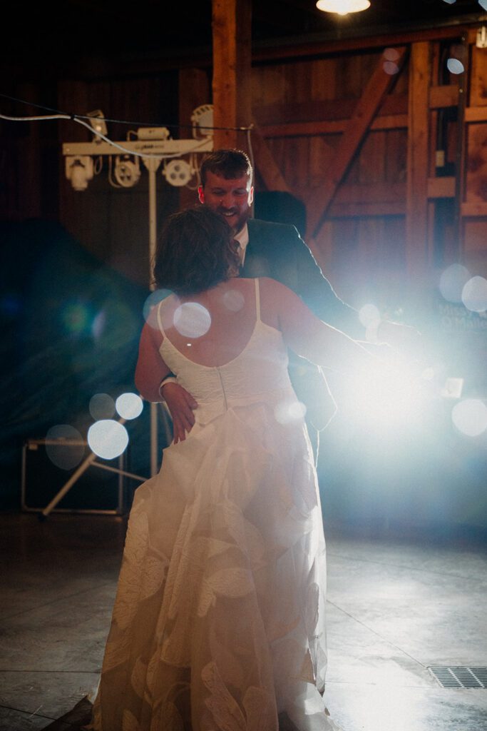 A fun non-traditional wedding in Bozeman with flower baskets, pizza, a “gaggle” wedding party, and sunset photos. See how this couple rewrote the rules.