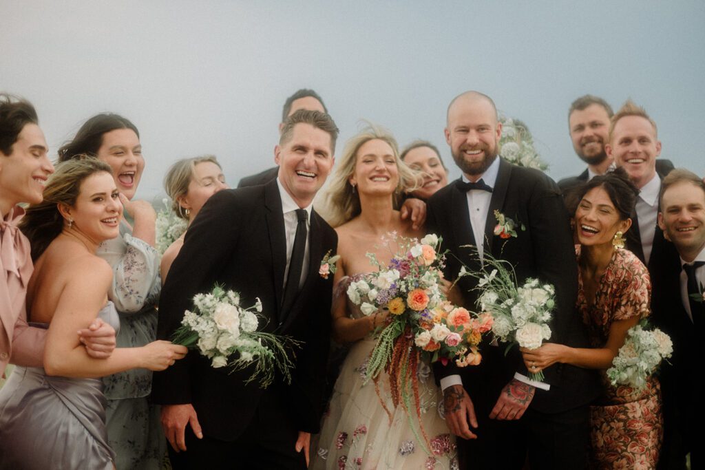 Colorful modern wedding in Bozeman at Firelight Farm featuring vibrant fashion, Filipino desserts, sunset portraits, and a disco after party.