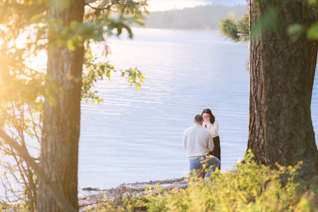 Whitefish surprise proposal on Whitefish Lake at sunset. Get tips on how to plan a surprise proposal, timing, outfit ideas, and how to make it feel natural and unforgettable.