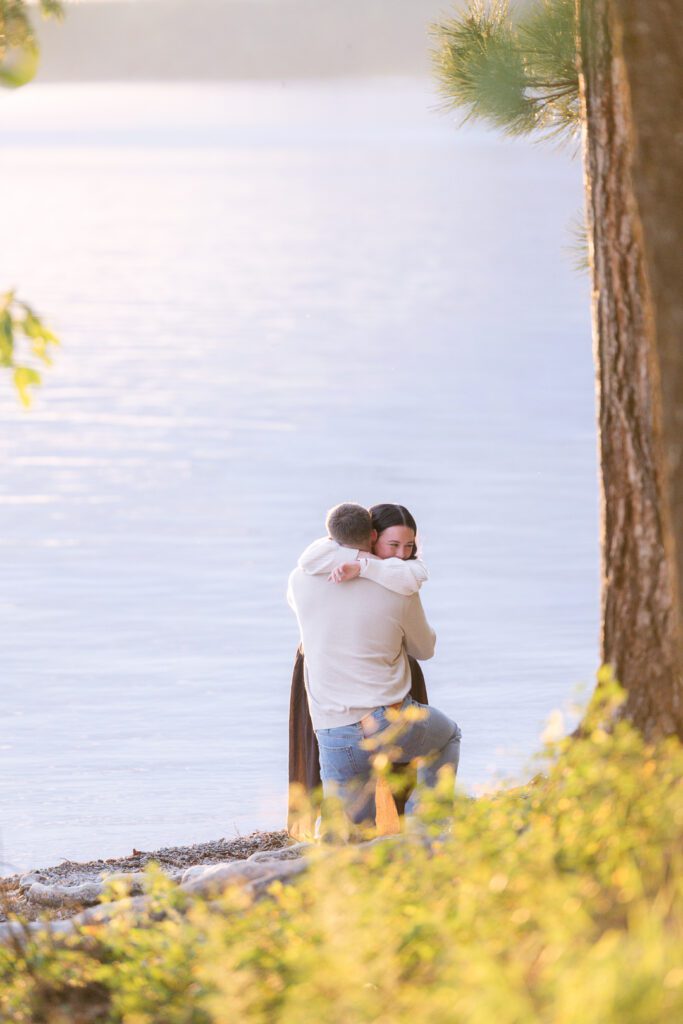 Whitefish surprise proposal on Whitefish Lake at sunset. Get tips on how to plan a surprise proposal, timing, outfit ideas, and how to make it feel natural and unforgettable.