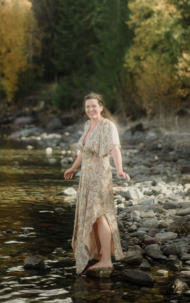 What to wear for your vow renewal. Bride in a snake skin colored dress with a high slit for a Glacier National Park vow renewal.