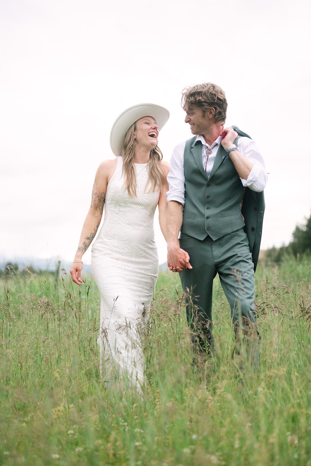 See Katy and Nick’s summer camp wedding in Montana at Luccock Park! Boho wedding style, live band and fun camp-inspired ideas.