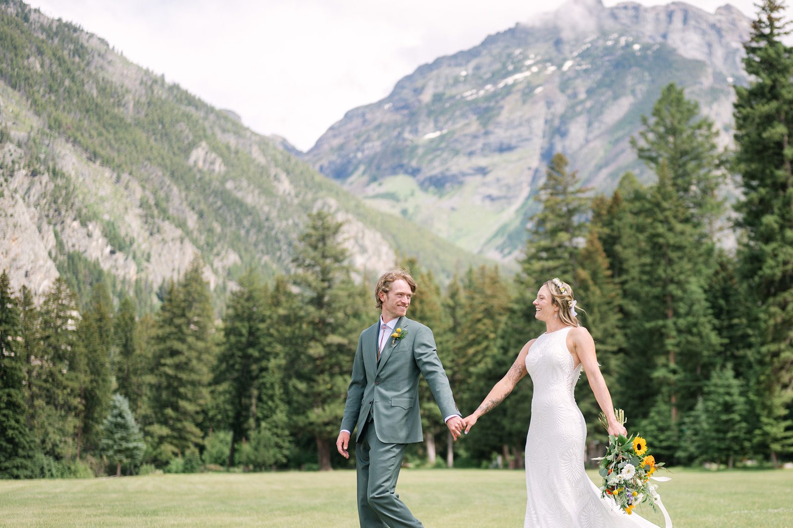 See Katy and Nick’s summer camp wedding in Montana at Luccock Park! Boho wedding style, live band and fun camp-inspired ideas.