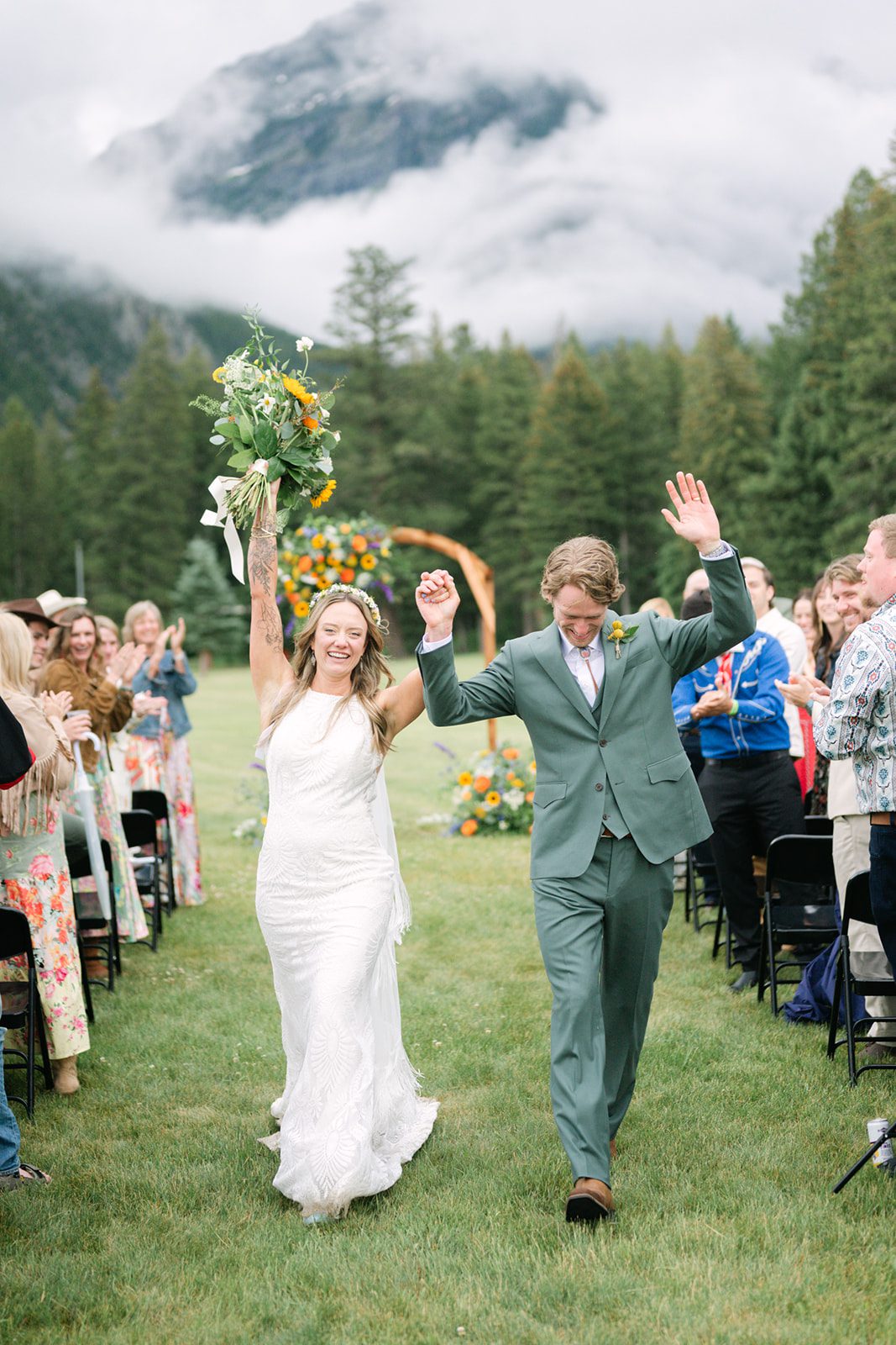 See Katy and Nick’s summer camp wedding in Montana at Luccock Park! Boho wedding style, live band and fun camp-inspired ideas.
